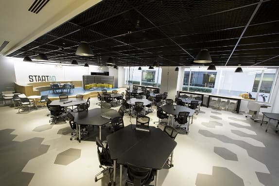 An open, multifunctional, modular space that enables collaboration, fostering of communities and bringing together entrepreneurial serendipity.